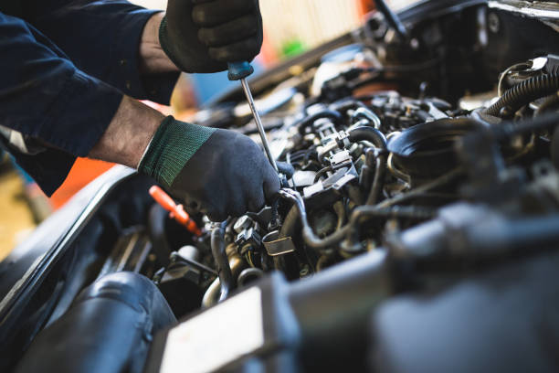 Mechanic servicing an engine at Euro Asia Autoworks