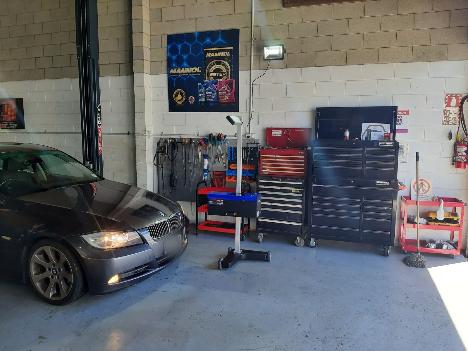 Headlight alignment equipment and tool chests in the Euro Asia Autoworks workshop